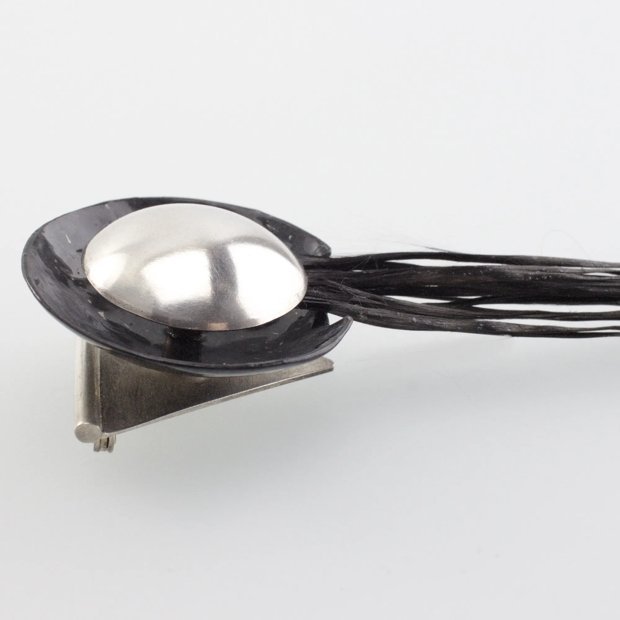 'FLARE' handmade sterling silver brooch with black carbon fibre