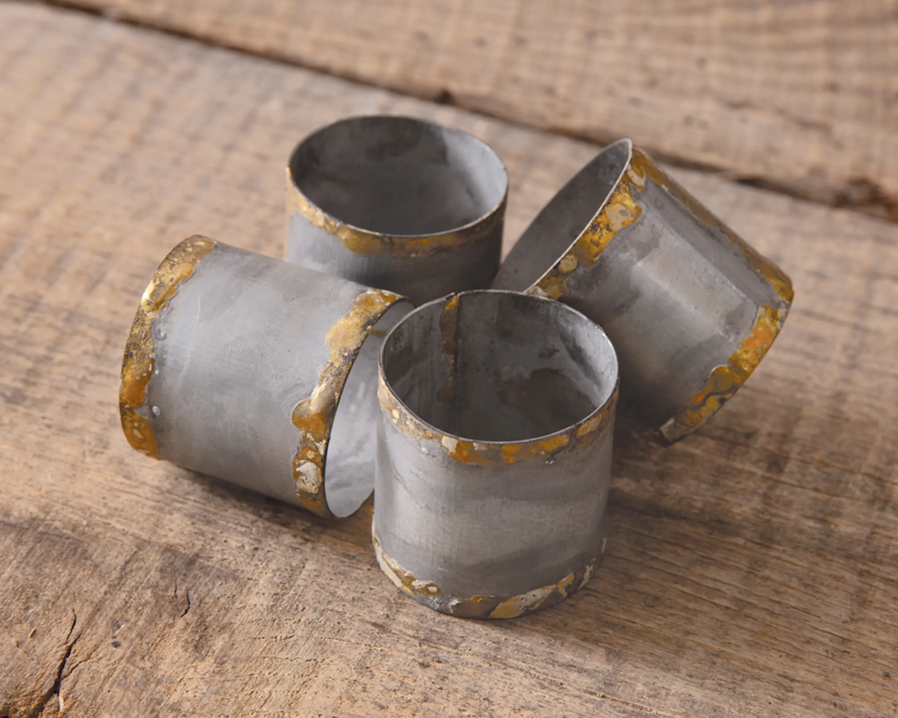 Galvanized metal napkin rings with gold rim