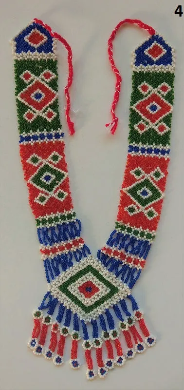 Long kuchi beaded necklace with tribal geometric patterns, made from miniature beads