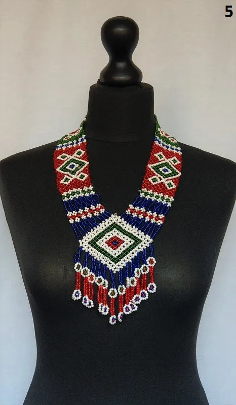 Long kuchi beaded necklace with tribal geometric patterns, made from miniature beads