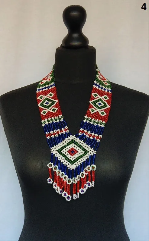 Long kuchi beaded necklace with tribal geometric patterns, made from miniature beads