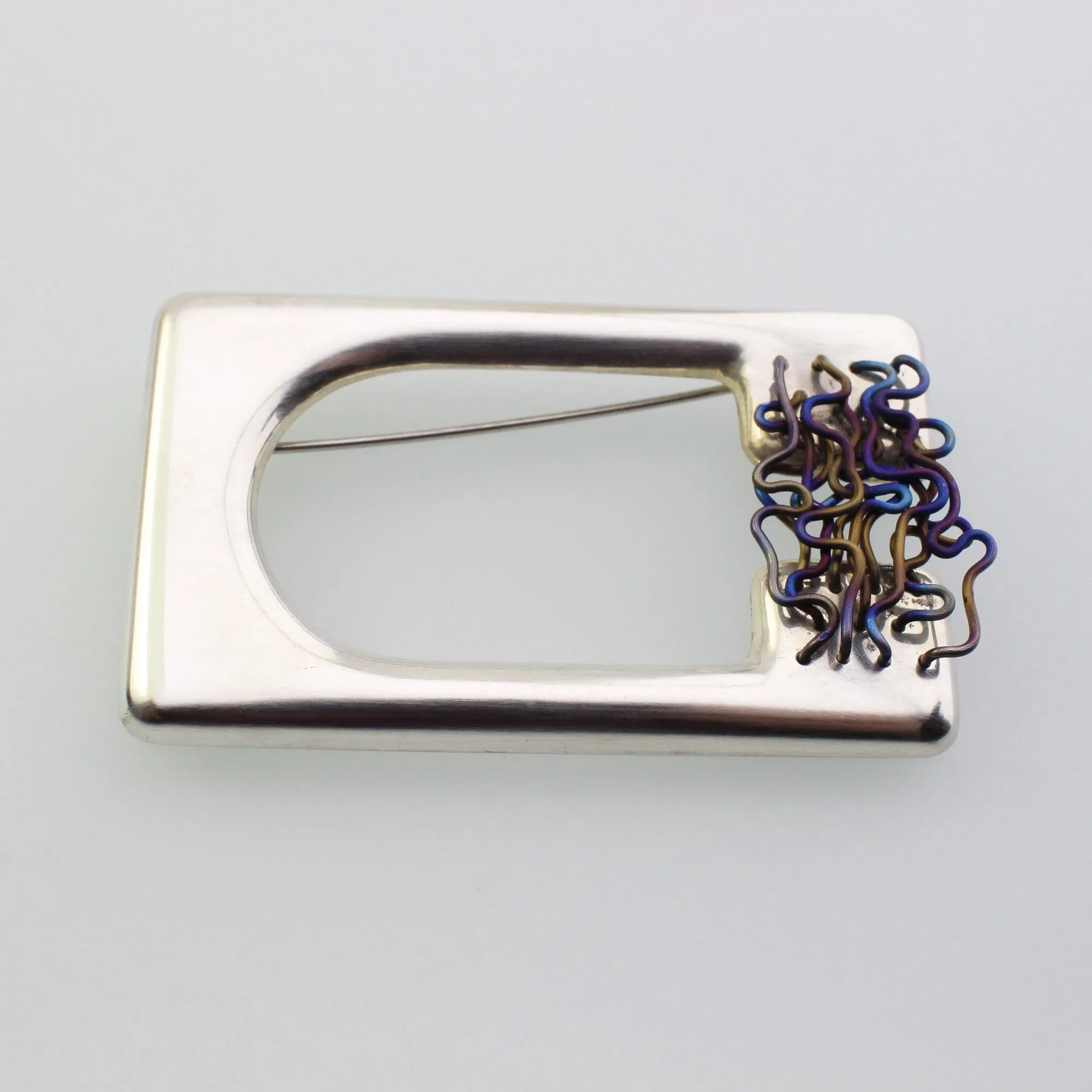 ‘ORGANISED CHAOS’ handmade sterling silver sculptural titanium brooch