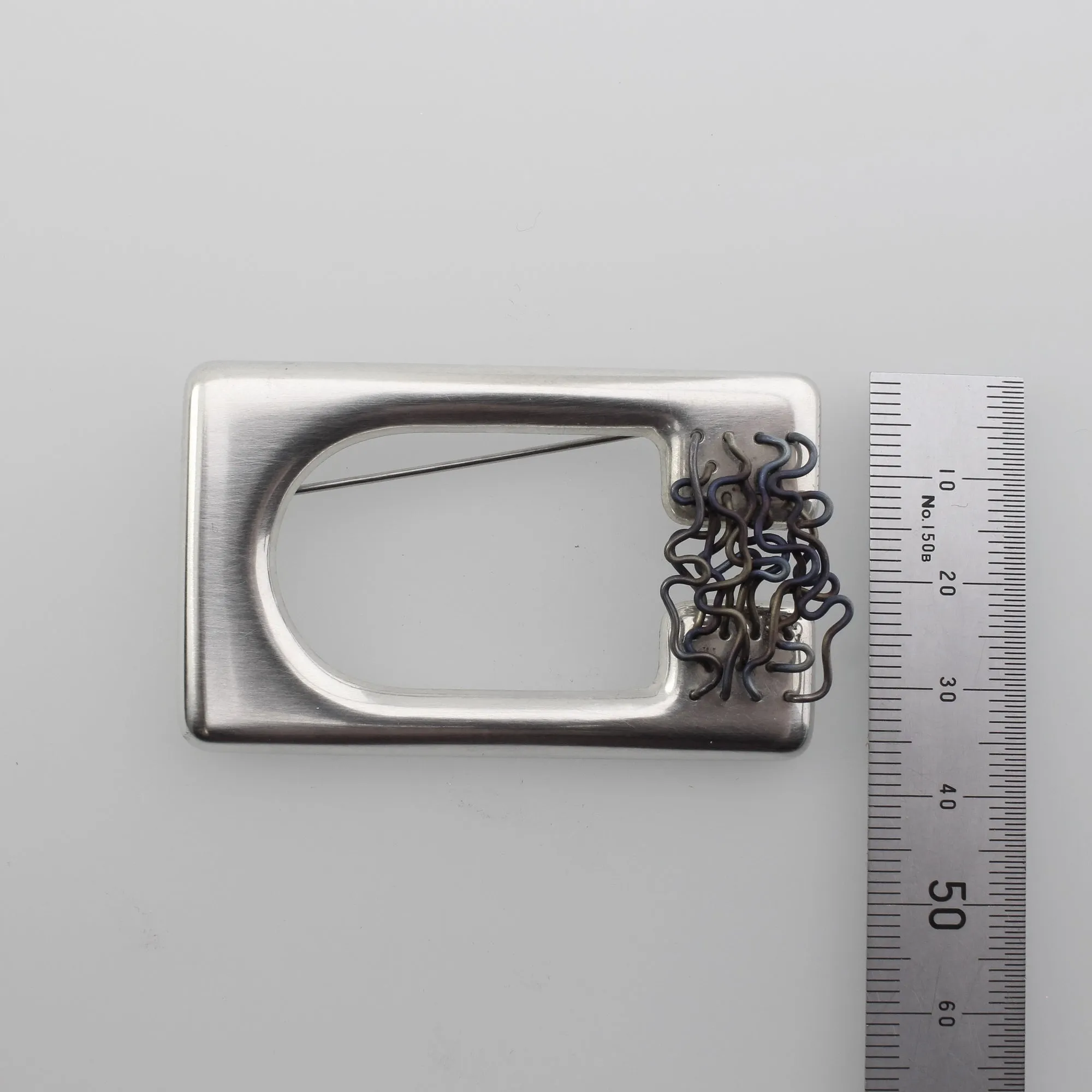 ‘ORGANISED CHAOS’ handmade sterling silver sculptural titanium brooch