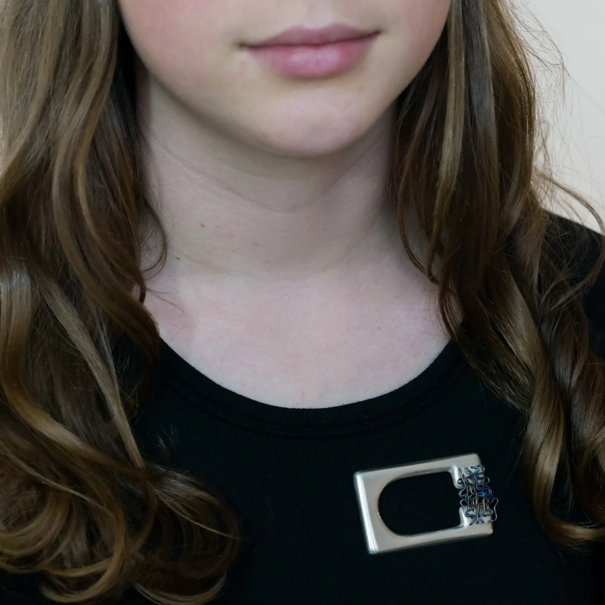 ‘ORGANISED CHAOS’ handmade sterling silver sculptural titanium brooch