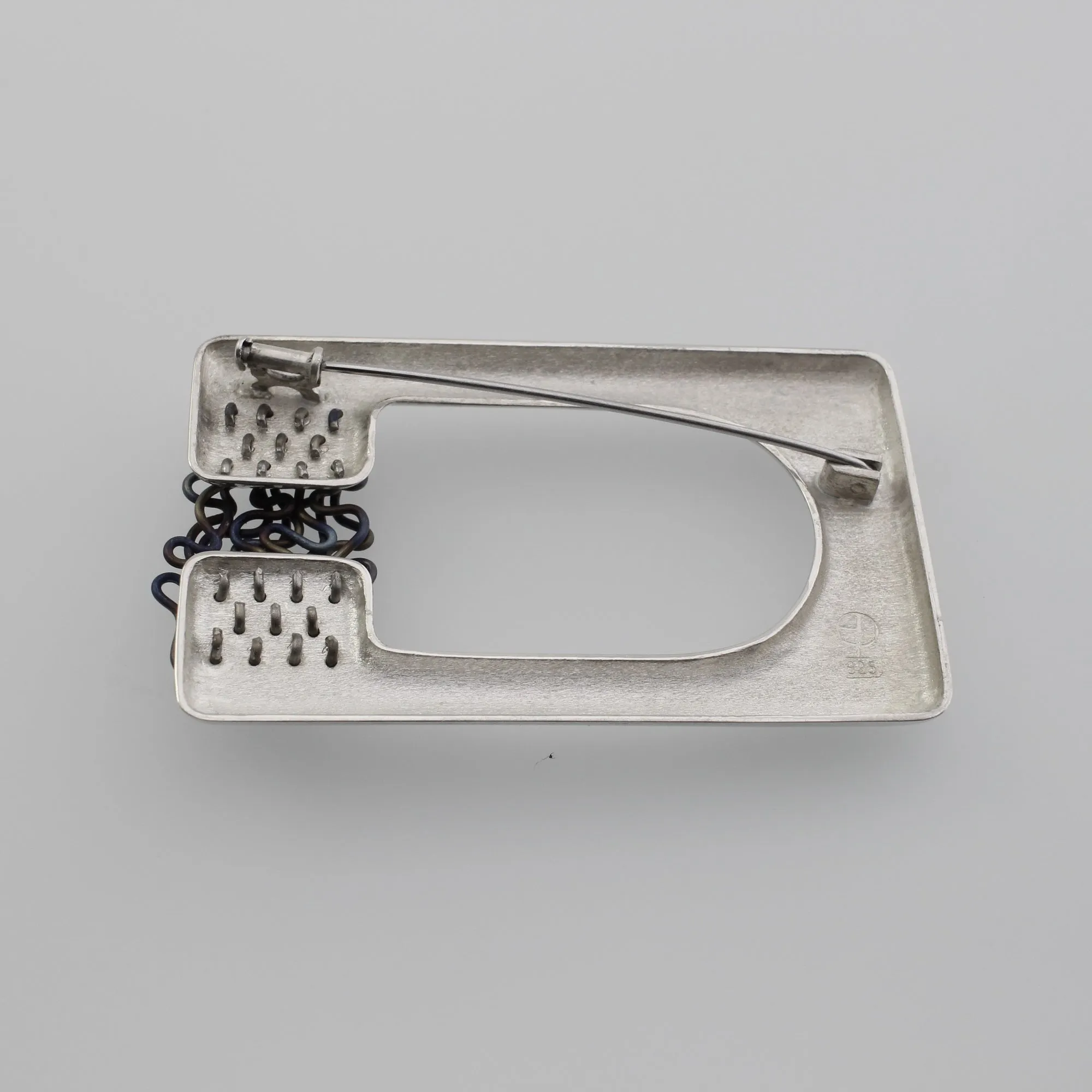 ‘ORGANISED CHAOS’ handmade sterling silver sculptural titanium brooch