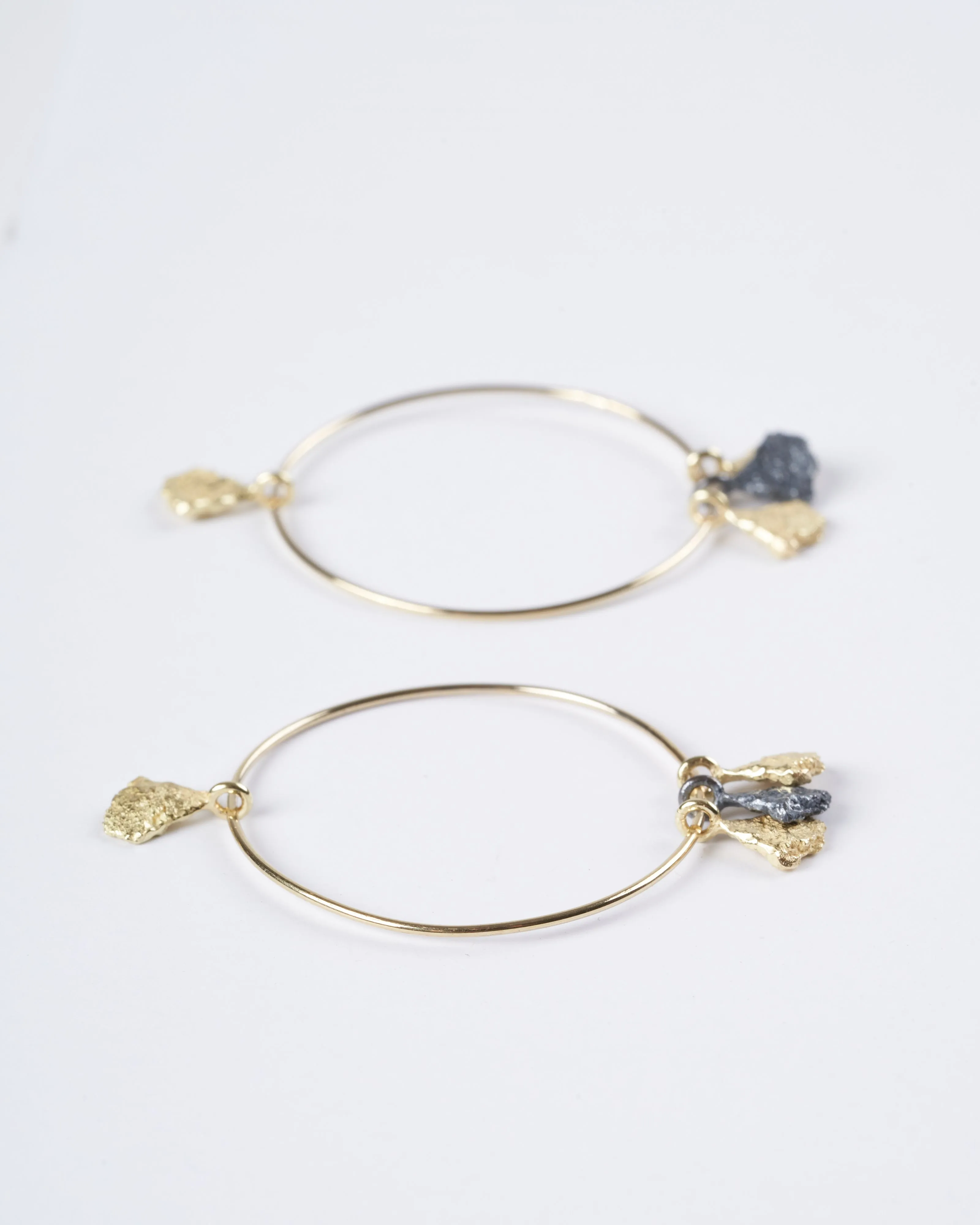 svelare earrings - 18k yellow gold, blackened sterling silver